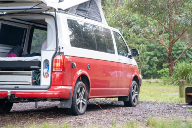 red and white van with boot door open