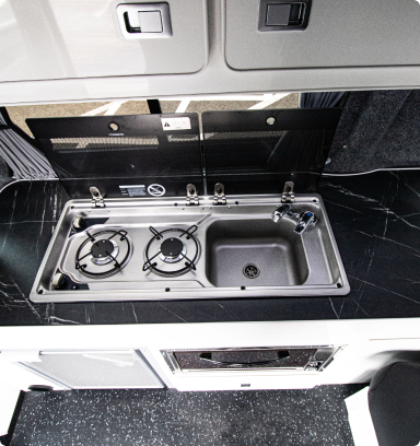 Hob and sink inside the campervan transporter