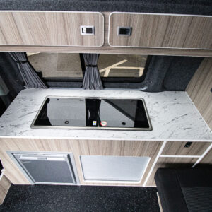 Overview of the sink and hob with hatches closed of the Ice Blue Campervan