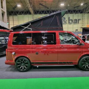 Side view of the T6.1 Volkswagen Transporter Startline Campervan in Fortana Red with a pop top