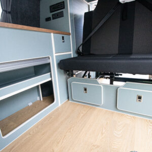 T6.1 Volkswagen Transporter Highline Campervan – Light Ivory – 24 Plate – A1198 angled view of the storage and lower seats