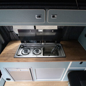 T6.1 Volkswagen Transporter Highline Campervan – Light Ivory – 24 Plate – A1198 overview of sink and stove with lid open