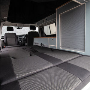 T6.1 Volkswagen Transporter Highline Campervan – Light Ivory – 24 Plate – A1198 with the seats reclined to make the bed