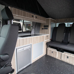 interior shot of the 6.1 Volkswagen Transporter Highline Campervan in Pure Grey with the seats up
