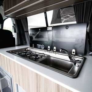 close up of the sink and the hob in a transporter campervan