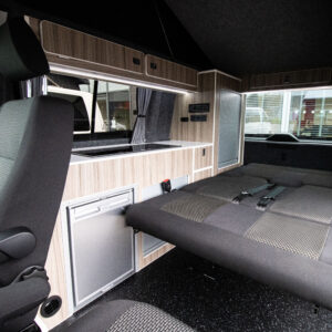 interior shot of a T6.1 Volkswagen Transporter Highline Campervan in Pure Grey with the bed down