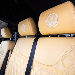 A close up of the interior front seats headrests