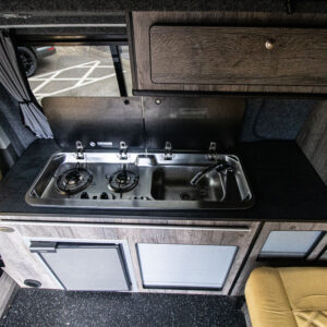 Overview of the sink and hob with the hatches open