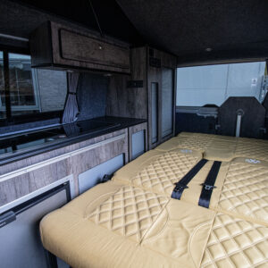 Interior shot of the back seats lowered to make the bed