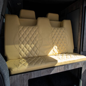 The rear seats in the boot of the campervan when up