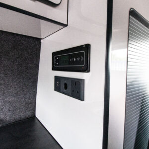 Close up of the control panel and plug sockets in the Pure Grey Campervan