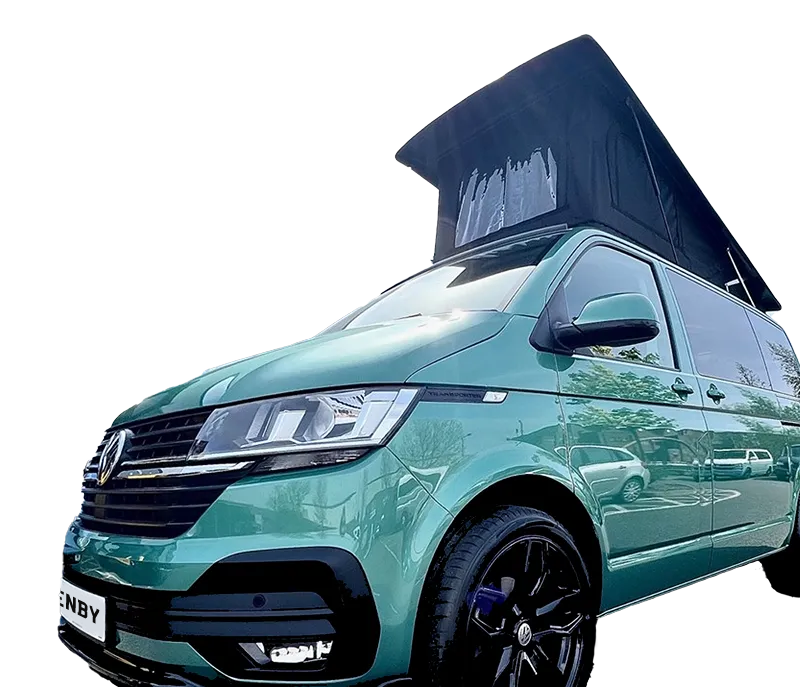 A green camper van with black wheels and a raised pop-top roof, shown from the front left angle, isolated on a transparent background.